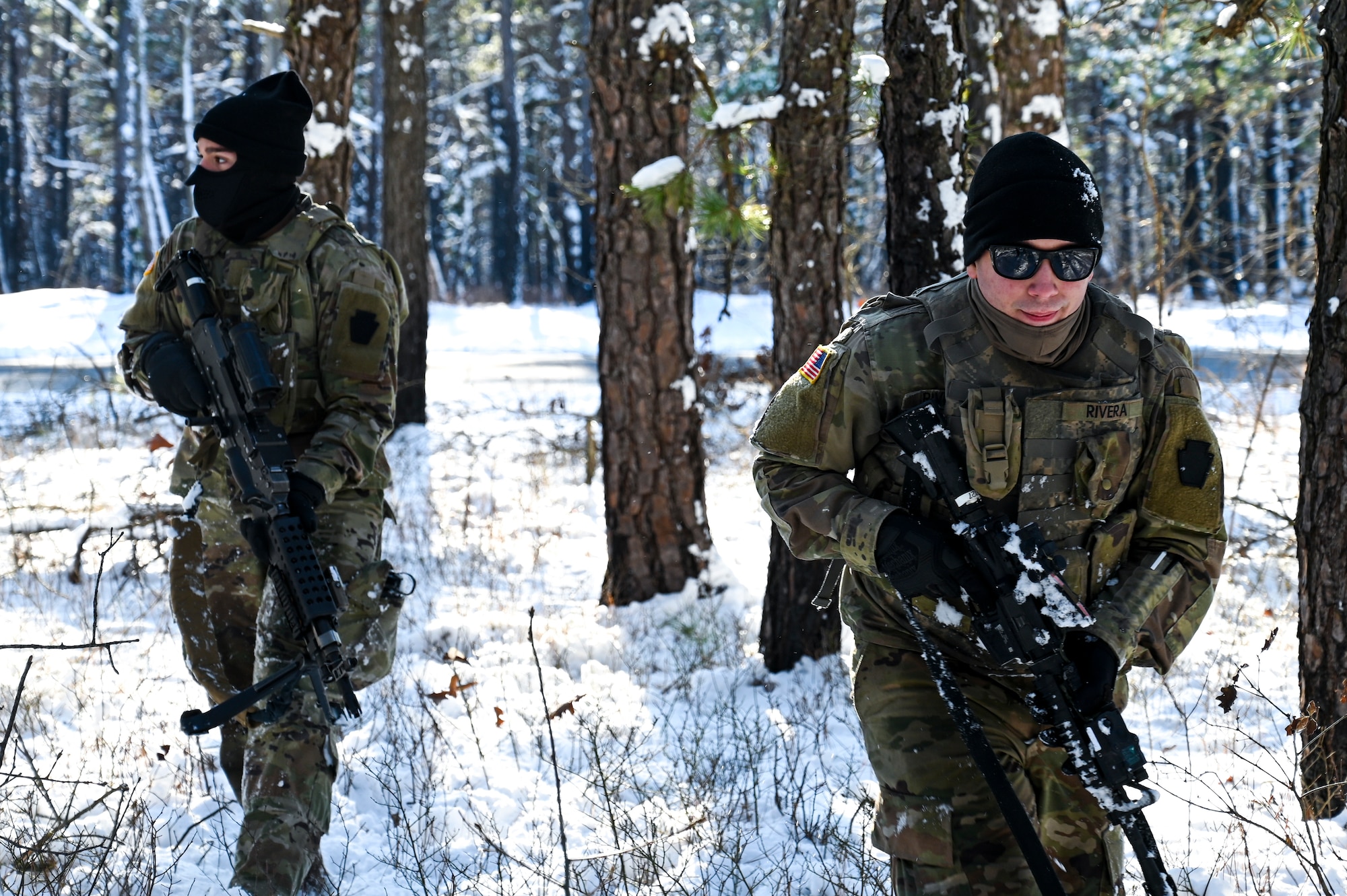 U.S. Army Pvt. Jason Rivera (Left) and U.S. Army Spc. Anthony Carcamo (Right), Third Platoon, Blackfoot Company, 111th Infantry Regiment, Infantrymen, pose for a photo with an M4 carbine assault rifle and a M240B machine gun on Jan. 7, 2022, at Joint Base McGuire-Dix-Lakehurst, N.J. Using a training range on Army Support Activity Dix, Soldiers conducted Situational Training Exercise Lanes (STX Lanes) and other contact drill training exercises to enhance combat readiness. STX Lanes are designed to simulate a search and attack before initial contact is made with the enemy, where moving undetected is critical to a favorable engagement. The 111th Infantry Regiment has Colonial roots in the American Revolution and was founded by Benjamin Franklin on Nov. 21, 1747. It is Pennsylvania’s oldest regiment and often assisted George Washington and the Continental Army alongside the Delaware River.