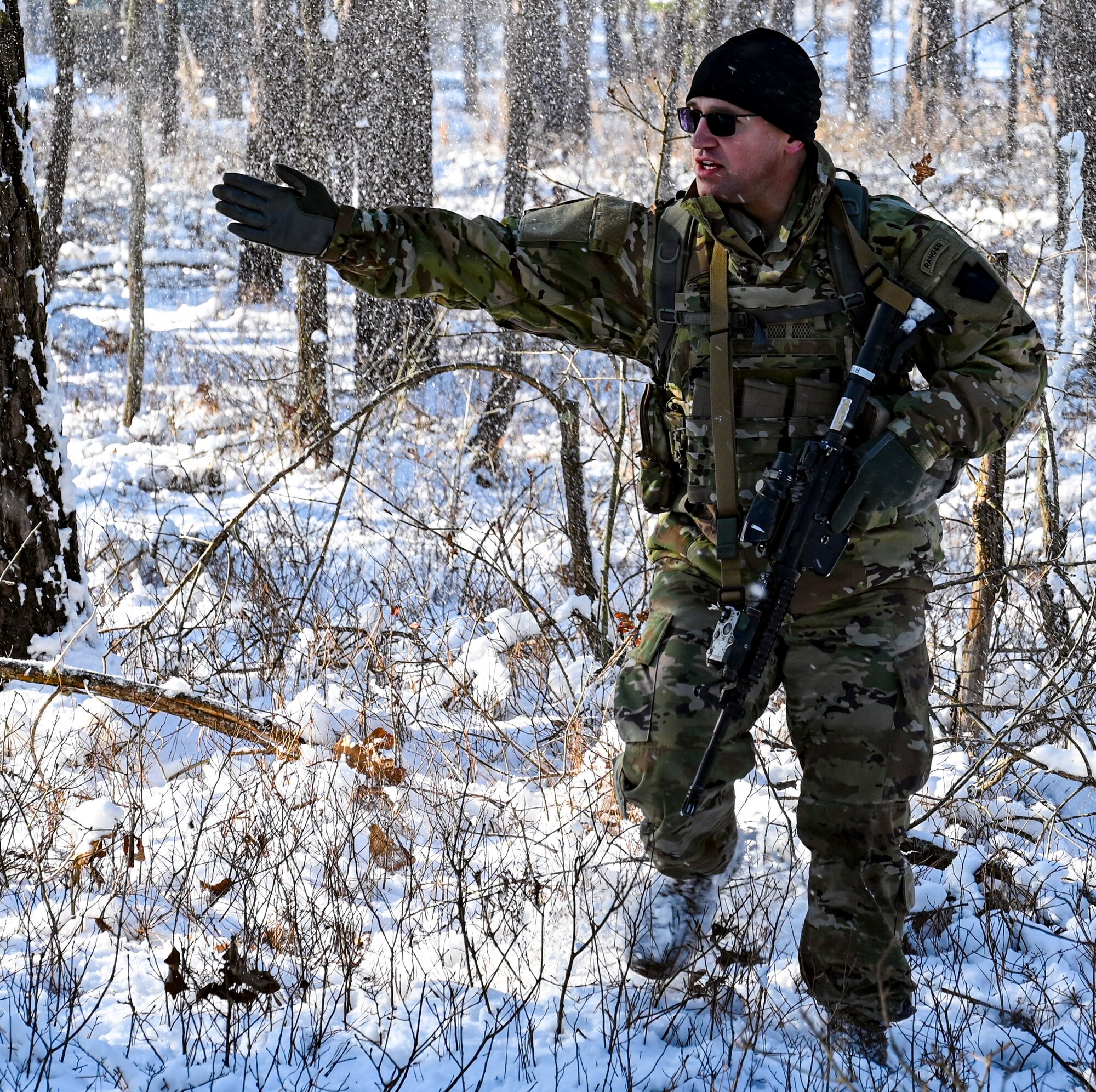 U.S. Army Sgt. Michael Stuckey, Third Platoon, Blackfoot Company, 111th Infantry Regiment, Infantryman, directs movements in forested terrain on Jan. 7, 2022, at Joint Base McGuire-Dix-Lakehurst, N.J. Using a training range on Army Support Activity Dix, Soldiers conducted Situational Training Exercise Lanes (STX Lanes) and other contact drill training exercises to enhance combat readiness. STX Lanes are designed to simulate a search and attack before initial contact is made with the enemy, where moving undetected is critical to a favorable engagement. The 111th Infantry Regiment has Colonial roots in the American Revolution and was founded by Benjamin Franklin on Nov. 21, 1747. It is Pennsylvania’s oldest regiment and often assisted George Washington and the Continental Army alongside the Delaware River.