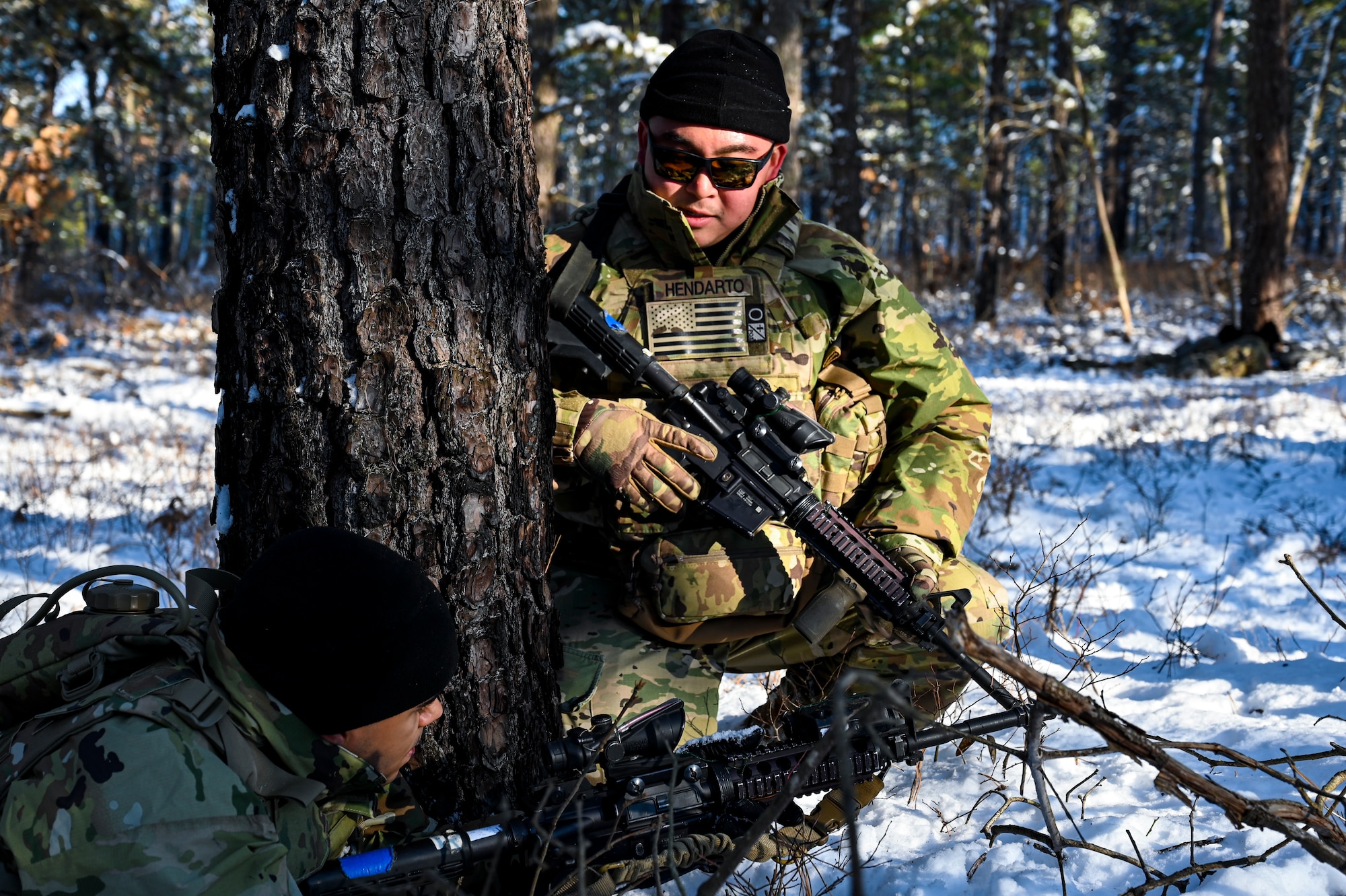 U.S. Army Sgt. Benjamin Hendarto (Right), Third Platoon, Blackfoot Company, 111th Infantry Regiment, Infantryman, checks in on a soldier on Jan. 7, 2022, at Joint Base McGuire-Dix-Lakehurst, N.J. Using a training range on Army Support Activity Dix, Soldiers conducted Situational Training Exercise Lanes (STX Lanes) and other contact drill training exercises to enhance combat readiness. STX Lanes are designed to simulate a search and attack before initial contact is made with the enemy, where moving undetected is critical to a favorable engagement. The 111th Infantry Regiment has Colonial roots in the American Revolution and was founded by Benjamin Franklin on Nov. 21, 1747. It is Pennsylvania’s oldest regiment and often assisted George Washington and the Continental Army alongside the Delaware River.