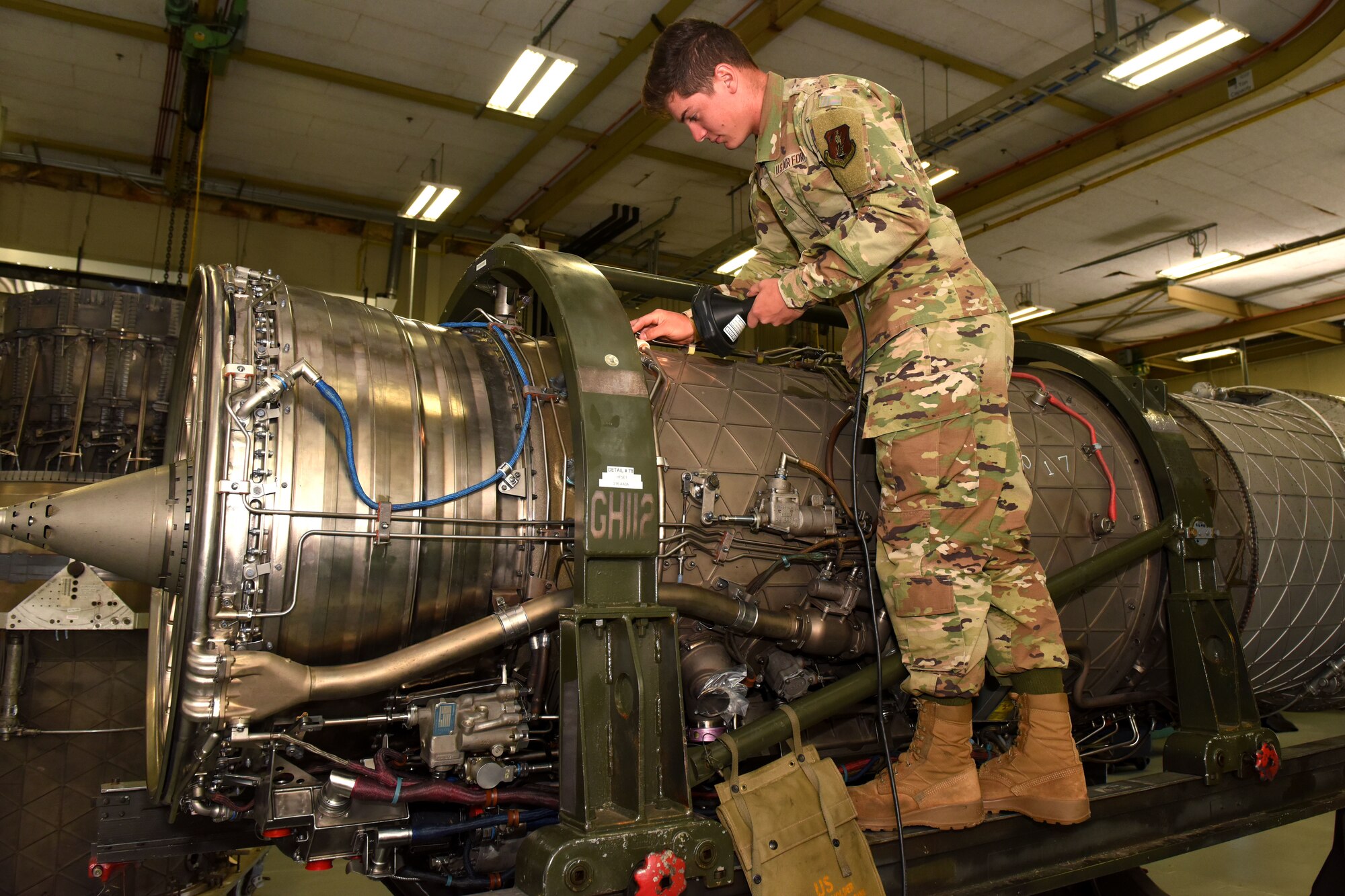 U.S. Air Force Airman 1st Class Steven Hershberger, a 169th Maintenance Squadron aerospace propulsion mechanic, conducts an inspection on an F-16 fighter jet engine at McEntire Joint National Guard Base, South Carolina, May 14, 2021. (U.S. Air National Guard photo by Senior Airman Mackenzie Bacalzo)