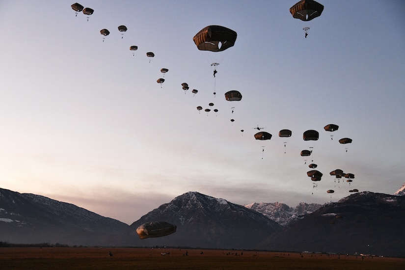 Paratroopers land.
