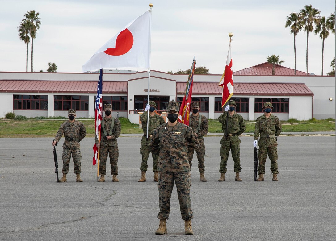 A joint color guard of U.S. Marines with the 15th Marine Expeditionary Unit and Japan Ground Self-Defense Force (JGSDF) soldiers with 2nd Amphibious Rapid Deployment Regiment stand in formation during the Exercise Iron Fist 2022 opening ceremony at Marine Corps Base Camp Pendleton, California, Jan. 10, 2022. For almost two decades the U.S. Marine Corps, U.S. Navy, and JGSDF have conducted Exercise Iron Fist, training together in amphibious operations and affirming the U.S. commitment to our allies. (U.S. Marine Corps photo by Cpl. Carl Matthew Ruppert)
