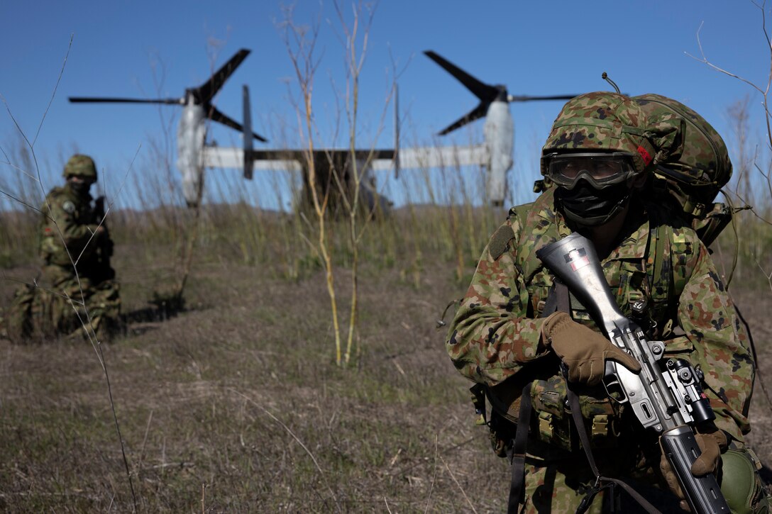 Japan Ground Self-Defense Force (JGSDF) soldiers with 2nd Amphibious Rapid Deployment Regiment post security after exiting a U.S Marine Corps MV-22 Osprey, assigned to Marine Medium Tiltrotor Squadron 164, during Exercise Iron Fist 2022 at Marine Corps Base Camp Pendleton, California, Jan. 11, 2022. For almost two decades the U.S. Marine Corps, U.S. Navy, and JGSDF have conducted Exercise Iron Fist, training together in amphibious operations and affirming the U.S. commitment to our allies. (U.S. Marine Corps photo by Cpl. Carl Matthew Ruppert)