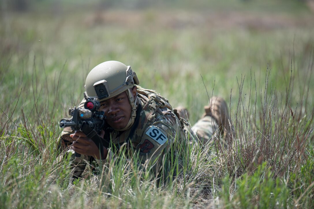 Airman 1st Class Emmanuel Collins, a fireteam member in the Kentucky Air National Guard’s 123rd Security Forces Squadron, takes up a defensive posture during a field training exercise at Fort Carson, Colo., May 19, 2021. More than 30 Airmen from the unit travelled here to strengthen their specialized skills during nine days of field exercises at several different ranges. (U.S. Air National Guard photo by Phil Speck)