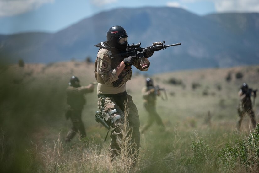 Members of the Kentucky Air National Guard’s 123rd Security Forces Squadron execute squad movement exercises at Fort Carson, Colo., May 20, 2021. More than 30 Airmen from the unit travelled here to strengthen their specialized skills during nine days of field exercises at several different ranges. (U.S. Air National Guard photo by Phil Speck)