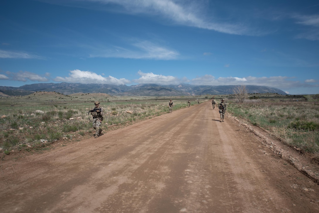 Members of the Kentucky Air National Guard’s 123rd Security Forces Squadron execute squad movement exercises at Fort Carson, Colo., May 18, 2021. More than 30 Airmen from the unit travelled here to strengthen their specialized skills during nine days of field exercises at several different ranges. (U.S. Air National Guard photo by Phil Speck)