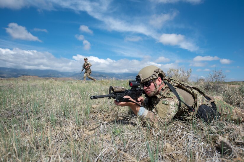 Senior Airman Colt May, a fireteam member in the Kentucky Air National Guard’s 123rd Security Forces Squadron, takes up a defensive posture during a field training exercise at Fort Carson, Colo., May 19, 2021. More than 30 Airmen from the unit travelled here to strengthen their specialized skills during nine days of field exercises at several different ranges. (U.S. Air National Guard photo by Phil Speck)