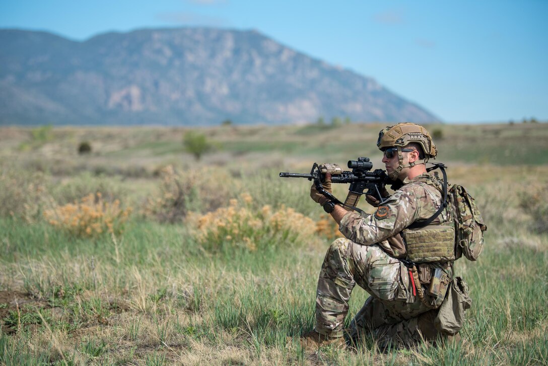 Staff Sgt. Nick Ward, an electronic security systems non-commissioned officer-in-charge in the Kentucky Air National Guard’s 123rd Security Forces Squadron, takes up a defensive posture during a field training exercise at Ft. Carson, Colo., May 19, 2021. More than 30 Airmen from the unit travelled here to strengthen their specialized skills during nine days of field exercises at several different ranges. (U.S. Air National Guard photo by Phil Speck)