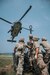 Airmen from the Kentucky Air National Guard’s 123rd Contingency Response Group prepare to hook a sling load to a U.S. Navy MH-60S Seahawk during a large-scale exercise in Logan, W.Va.., on July 20, 2021. The training took place during a week-long exercise named Sentry Storm 2021 that included multiple units including Air and Army National Guard, U.S. Air Force, Air Force Reserve, U.S. Navy, and Civil Air Patrol. U.S. Air National Guard photo by Staff Sgt. Vincent Santos)