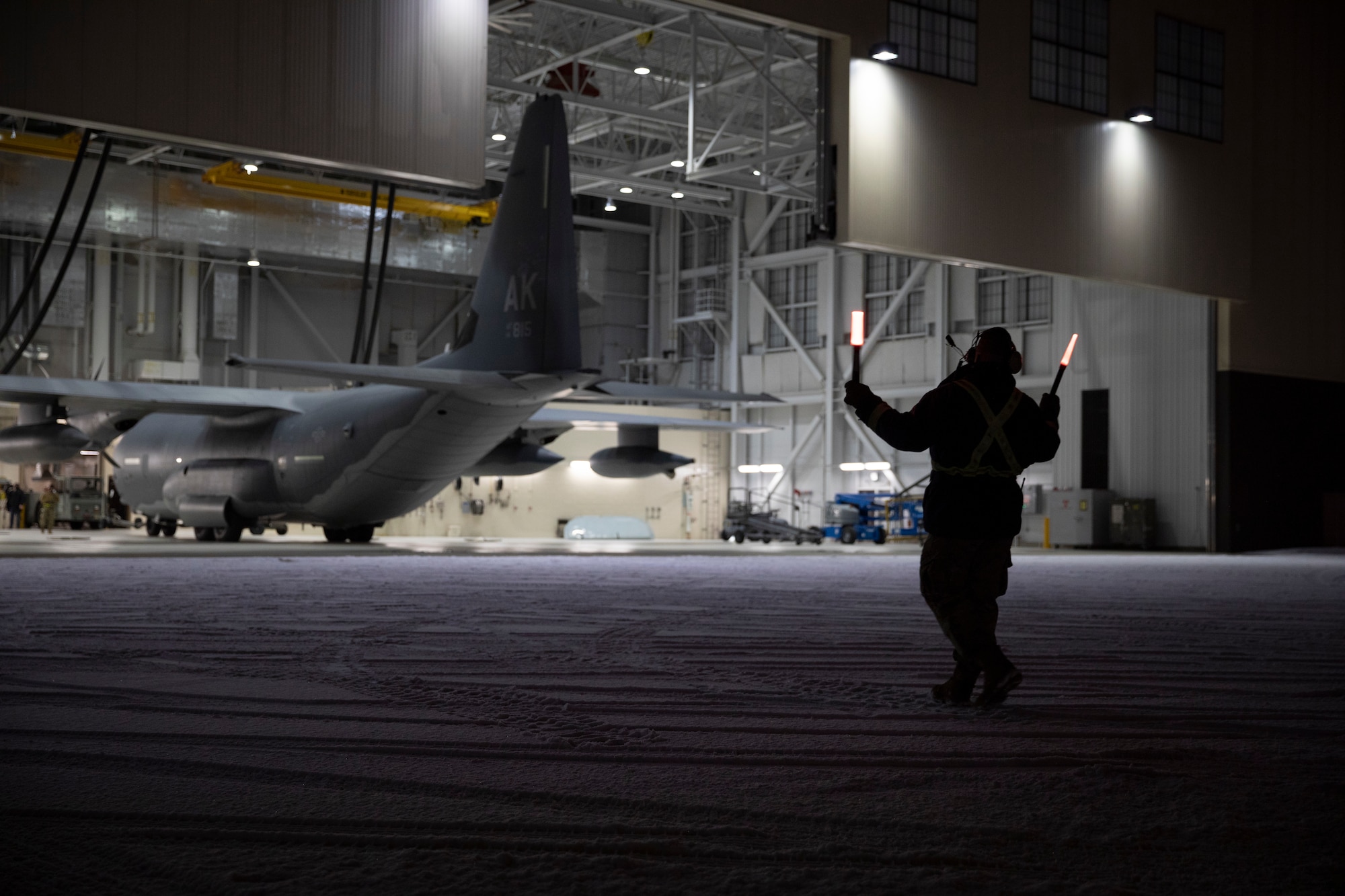 Alaska National Guard Soldiers and Airmen aboard an HC-130J Combat King II on Joint Base Elmendorf-Richardson Jan. 12, 2022, depart for the Southeast Alaska community of Yakutat. Guard members serving on Joint Task Force-Yakutat will provide building safety assessments and emergency snow removal for Tribal, public and government facilities in the community following hazardous winter weather and heavy snowfall resulting in building damage and continued risk of unsafe conditions. Yakutat is in the Tongass National Forest, the largest National Forest in the U.S. and home to the largest population of bald eagles in the world. The Alaska National Guard is trained, equipped and ready to provide disaster response support for the State of Alaska when requested by civil authorities. (U.S. Army National Guard photo by Spc. Grace Nechanicky)