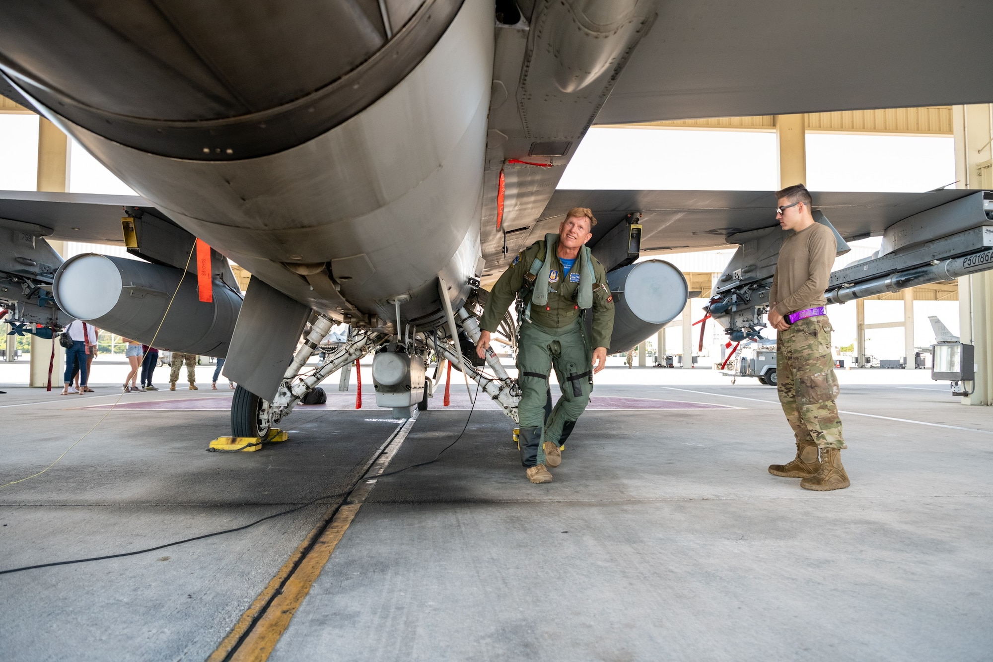 Lt. Col Joseph “Hooter” Feheley performs a pre-flight inspection on an F-16 Fighting Falcon prior to his final flight the day of his retirement at Homestead Air Reserve Base, Florida, Dec. 10, 2021. (U.S. Air Force photo by Master Sgt. Allissa Landgraff)