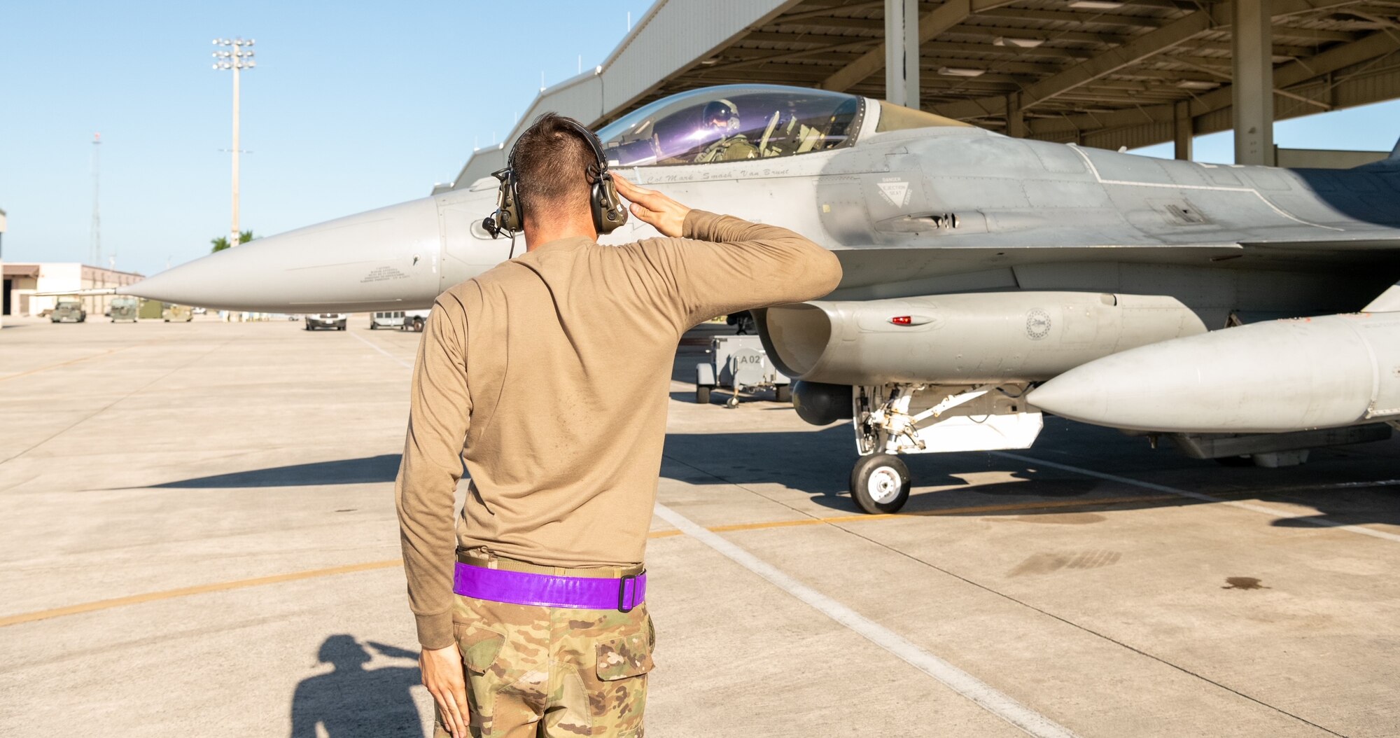 Lt. Col Joseph “Hooter” Feheley receives a salute prior to his final flight in an F-16 Fighting Falcon the day of his retirement at Homestead Air Reserve Base, Florida, Dec. 10, 2021. (U.S. Air Force photo by Master Sgt. Allissa Landgraff)