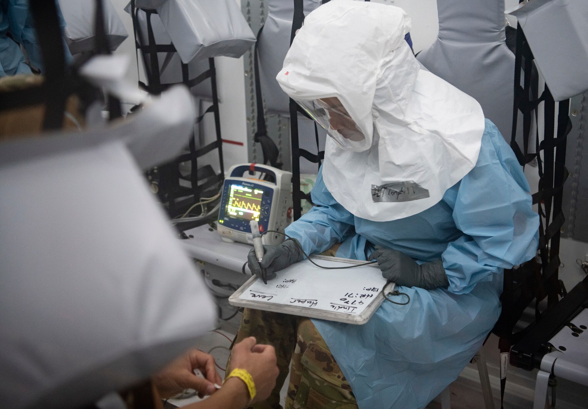 Airman writing down information.