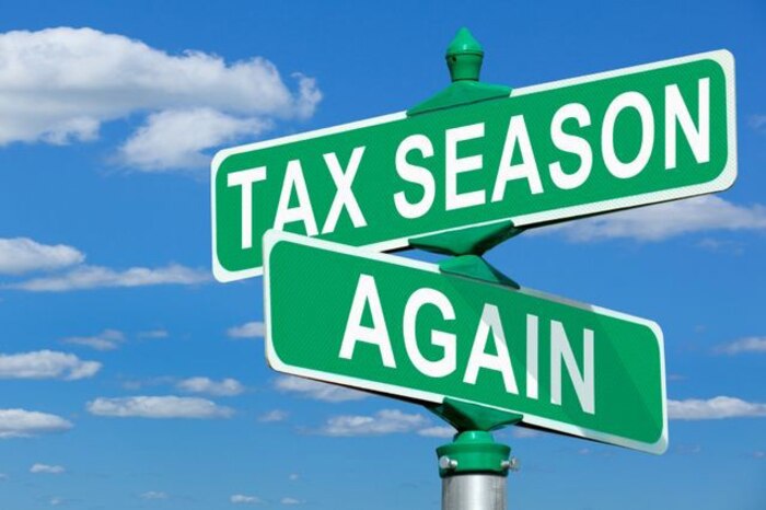 Photo illustration of street intersection signs, one reading "TAX SEASON" and the other, "AGAIN."