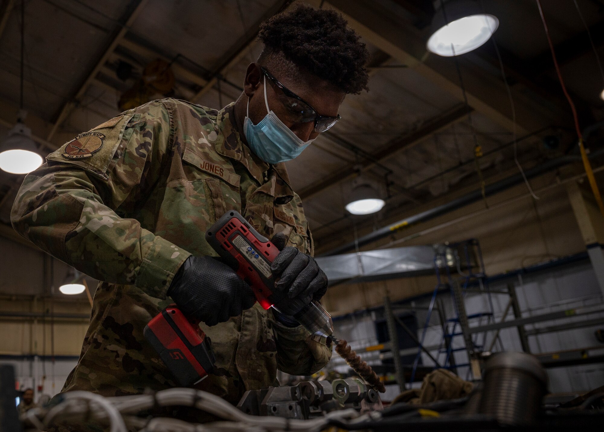 Senior Airman Dennis Jones, 414th Maintenance Squadron aircraft armament system technician, cleans a BRU-47 bomb rack at Seymour Johnson Air Force Base, North Carolina, Nov. 17, 2021.