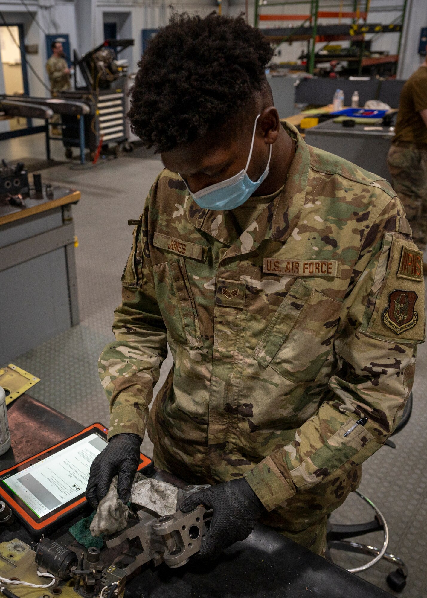 Senior Airman Dennis Jones, 414th Maintenance Squadron aircraft armament system technician, cleans a BRU-47 bomb rack at Seymour Johnson Air Force Base, North Carolina, Nov. 17, 2021.