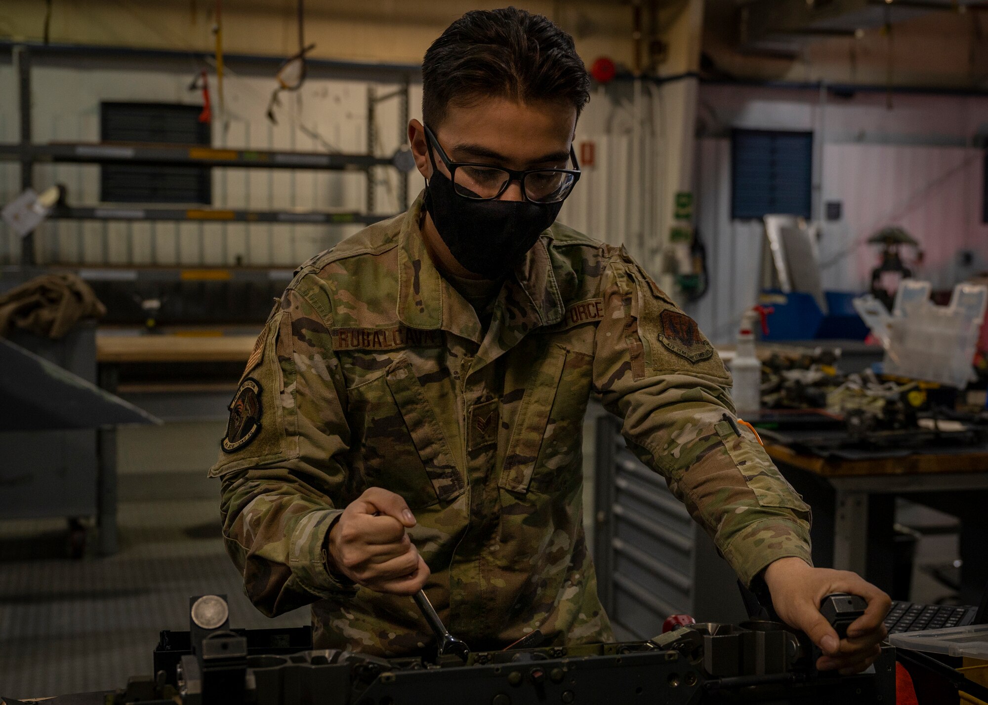 Senior Airman David Rubalcava, 4th Munitions Squadron aircraft armament systems technician, inspects a bomb rack at Seymour Johnson Air Force Base, North Carolina, Nov. 17, 2021.