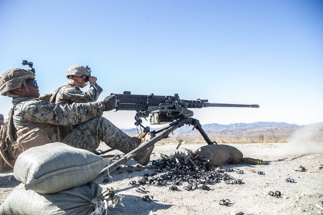 A machine gunner fires polymer rounds from a .50-caliber machine gun at Marine Corps Base Camp Pendleton, California