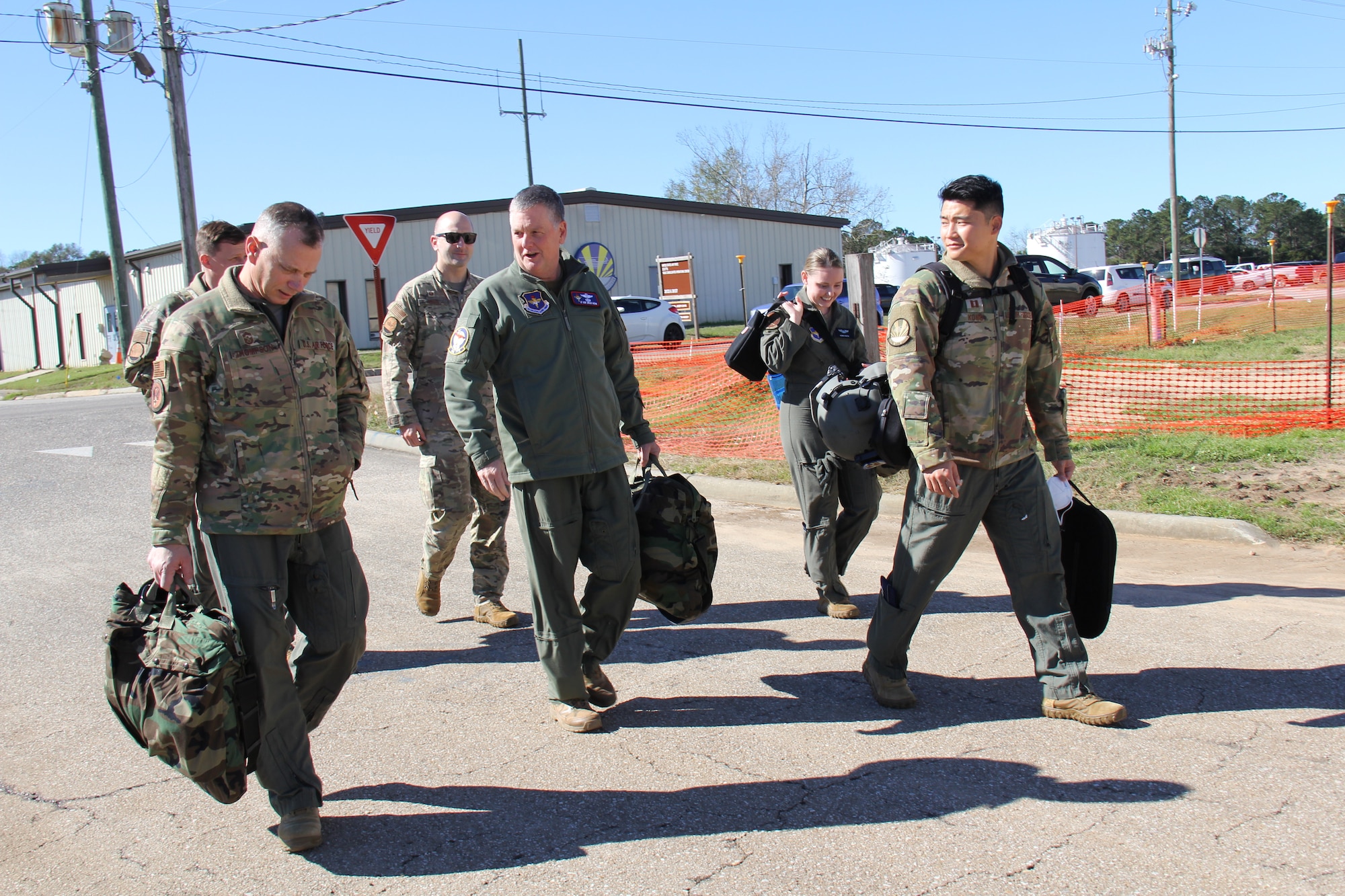 Air Force Chief Master Sgt. Erik Thompson, Air Education and Training Command’s command chief master sergeant, and Lt. Gen. Marshall B. “Brad” Webb, AETC commander, walk to the Fort Rucker, Ala., flightline with 23rd Flying Training Squadron Airmen for an orientation flight in a TH-1H Huey
