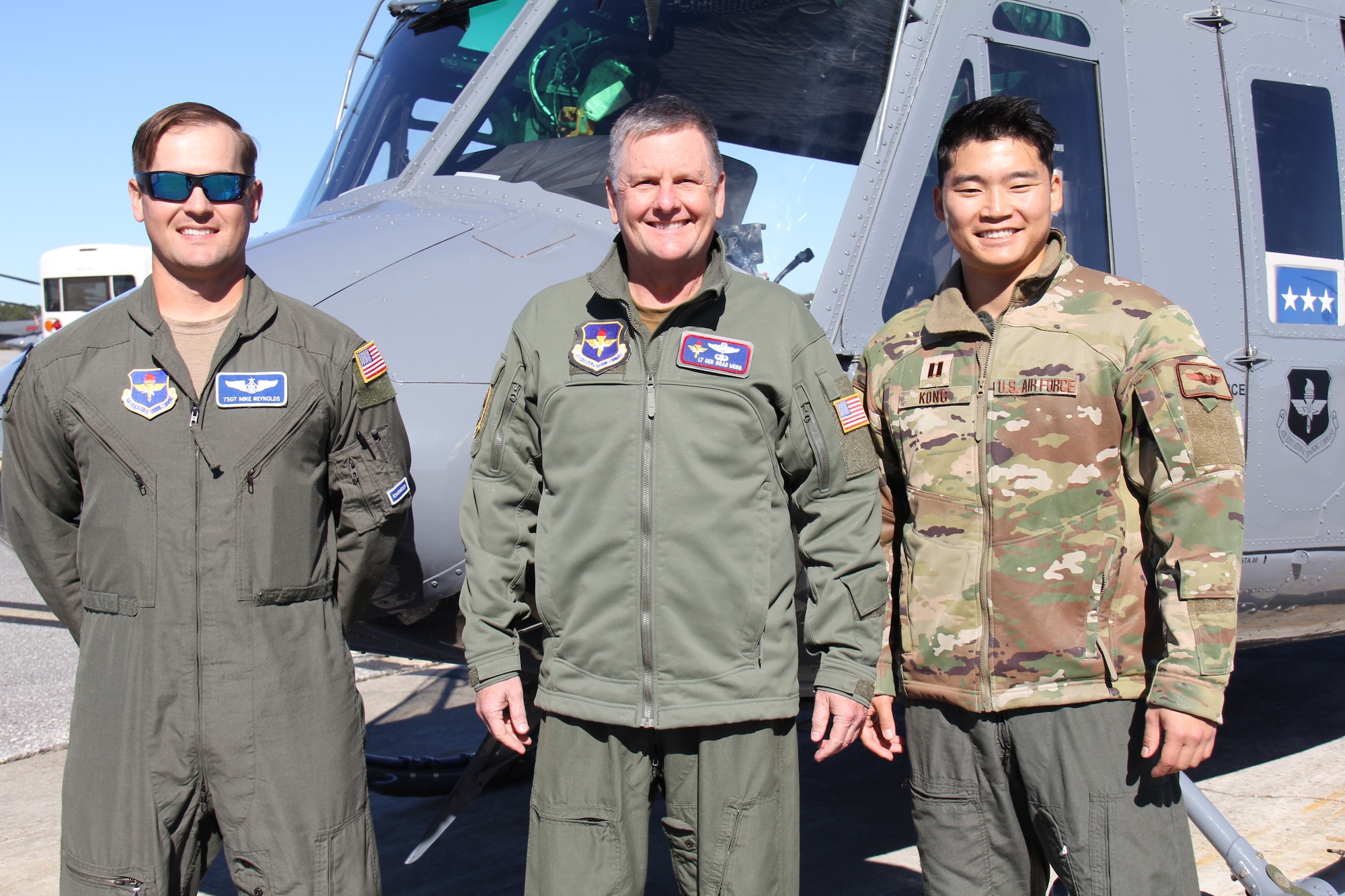 Air Force Technical Sgt. Jared Reynolds, 23rd FTS special missions aviator instructor, Lt. Gen. Marshall B. “Brad” Webb, commander of Air Education and Training Command, and Capt. Austin Kong, 23rd FTS instructor pilot, prepare for an orientation flight in a TH-1H Huey