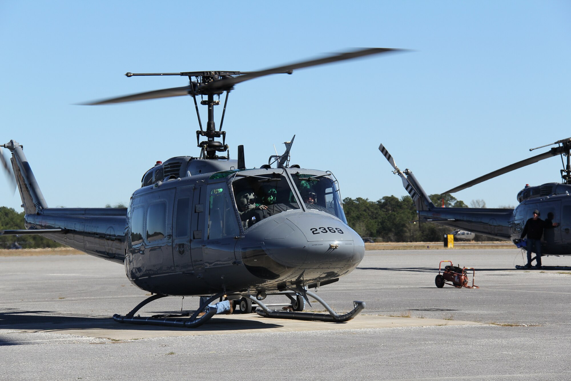Air Force Lt. Gen. Marshall B. “Brad” Webb, commander of Air Education and Training Command, Capt. Austin Kong, 23rd FTS instructor pilot, and Technical Sgt. Jared Reynolds, 23rd FTS special missions aviator instructor, head out on an orientation flight in a TH-1H Huey at Fort Rucker, Ala., Jan. 11.