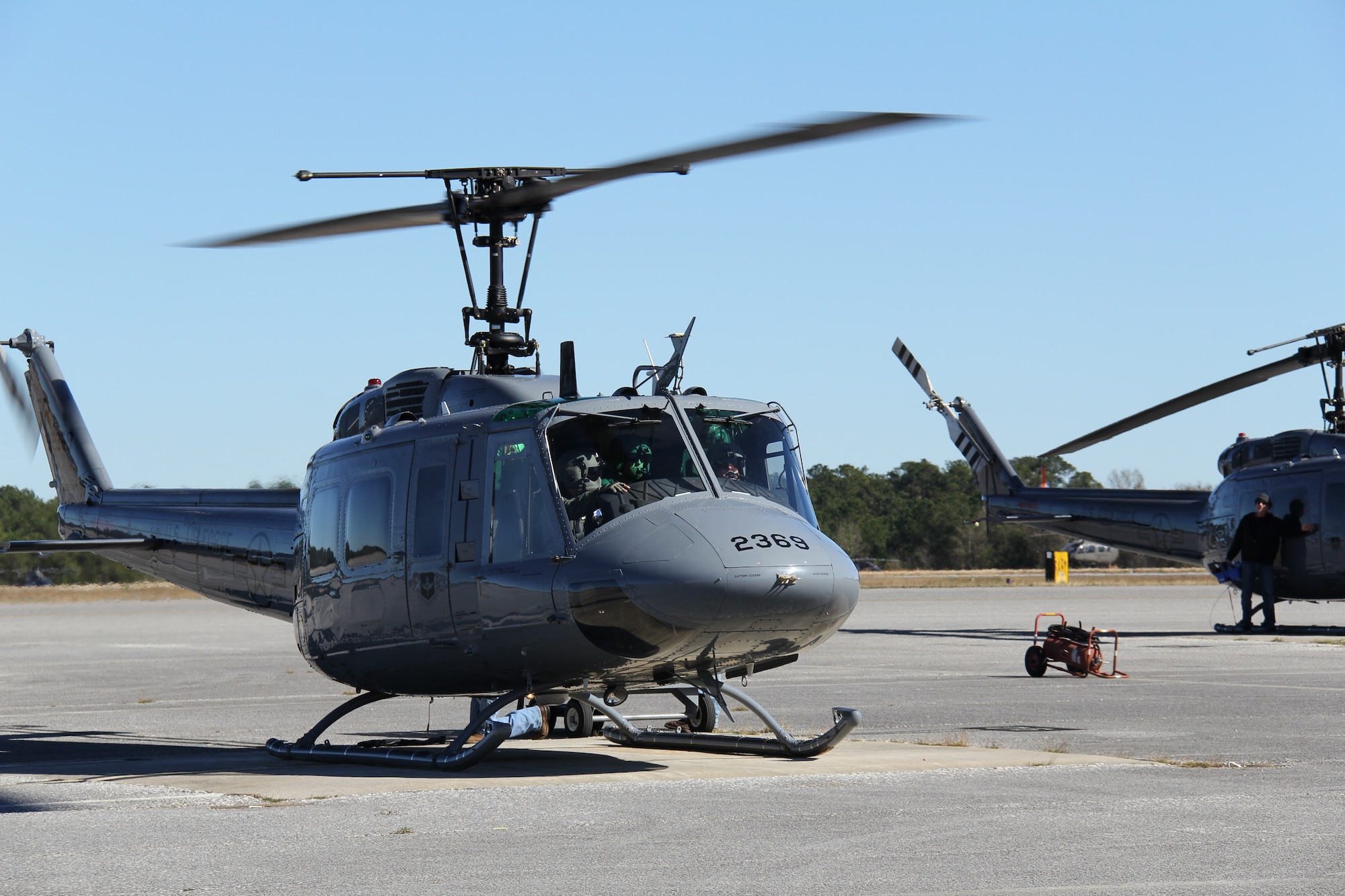 Air Force Lt. Gen. Marshall B. “Brad” Webb, commander of Air Education and Training Command, Capt. Austin Kong, 23rd FTS instructor pilot, and Technical Sgt. Jared Reynolds, 23rd FTS special missions aviator instructor, head out on an orientation flight in a TH-1H Huey at Fort Rucker, Ala., Jan. 11.