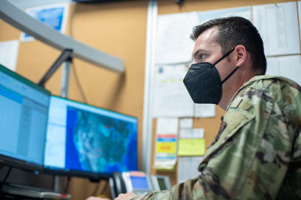 U.S. Air Force Tech. Sgt. Scott Tibbetts, Air Force Rescue Coordination Center noncommissioned officer in charge of standards and events, watches a computer screen at Tyndall Air Force Base, Florida, Aug. 11, 2021. The AFRCC is the only rescue coordination center for the entire continental United States. They also work closely with Canada and Mexico to coordinate search and rescue assistance when needed. (Airman 1st Class Tiffany Price)