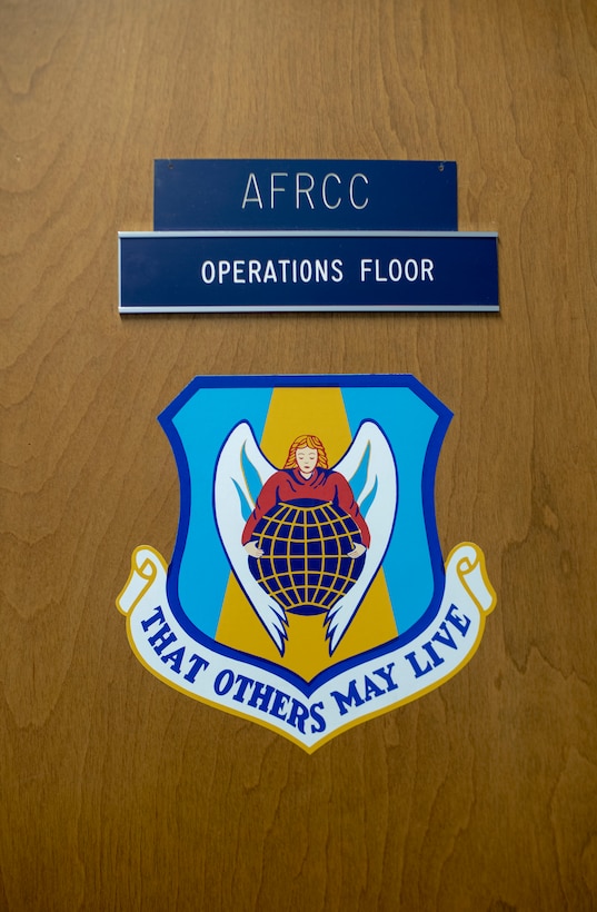 The Air Force rescue community’s motto “That Others May Live” is displayed on the door of the Air Force Rescue Coordination Center’s operations floor at Tyndall Air Force Base, Florida, Aug. 11, 2021. The AFRCC assisted with 762 rescue missions and 349 saves in 2020. (U.S. Air Force photo by Airman 1st Class Tiffany Price)