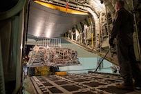 Alaska National Guard Airmen load an HC-130J Combat King II on Joint Base Elmendorf-Richardson Jan. 12, 2022, before a team of Army and Air Guardsmen depart for the Southeast Alaska community of Yakutat. Guard members serving on Joint Task Force-Yakutat will provide building safety assessments and emergency snow removal for Tribal, public and government facilities in the community following hazardous winter weather and heavy snowfall resulting in building damage and continued risk of unsafe conditions. Yakutat is in the Tongass National Forest, the largest National Forest in the U.S. and home to the largest population of bald eagles in the world. The Alaska National Guard is trained, equipped and ready to provide disaster response support for the State of Alaska when requested by civil authorities. (U.S. Army National Guard photo by Spc. Grace Nechanicky)