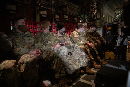 Alaska National Guard Soldiers and Airmen board an HC-130J Combat King II on Joint Base Elmendorf-Richardson Jan. 12, 2022, before departing for the Southeast Alaska community of Yakutat. Guard members serving on Joint Task Force-Yakutat will provide building safety assessments and emergency snow removal for Tribal, public and government facilities in the community following hazardous winter weather and heavy snowfall resulting in building damage and continued risk of unsafe conditions. Yakutat is in the Tongass National Forest, the largest National Forest in the U.S. and home to the largest population of bald eagles in the world. The Alaska National Guard is trained, equipped and ready to provide disaster response support for the State of Alaska when requested by civil authorities. (U.S. Army National Guard photo by Spc. Grace Nechanicky)