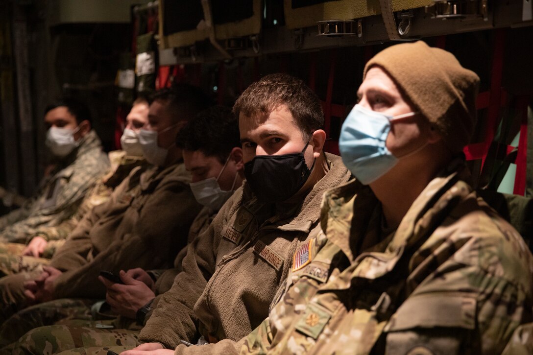 Alaska National Guard Soldiers and Airmen board an HC-130J Combat King II on Joint Base Elmendorf-Richardson Jan. 12, 2022, before departing for the Southeast Alaska community of Yakutat. Guard members serving on Joint Task Force-Yakutat will provide building safety assessments and emergency snow removal for Tribal, public and government facilities in the community following hazardous winter weather and heavy snowfall resulting in building damage and continued risk of unsafe conditions. Yakutat is in the Tongass National Forest, the largest National Forest in the U.S. and home to the largest population of bald eagles in the world. The Alaska National Guard is trained, equipped and ready to provide disaster response support for the State of Alaska when requested by civil authorities. (U.S. Army National Guard photo by Spc. Grace Nechanicky)