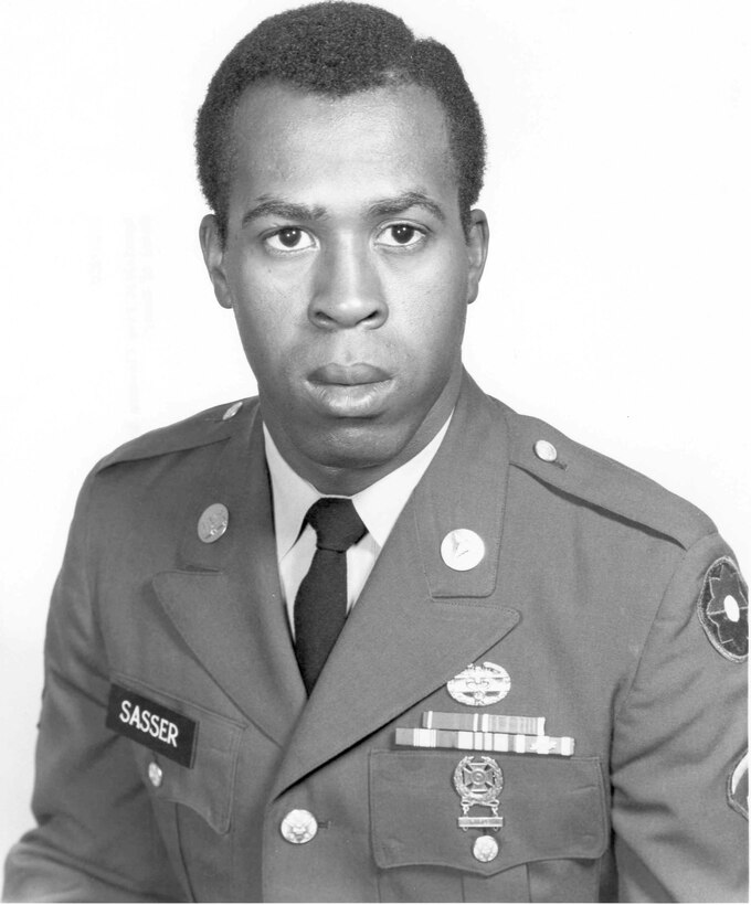 A man in dress uniform poses for a photo.