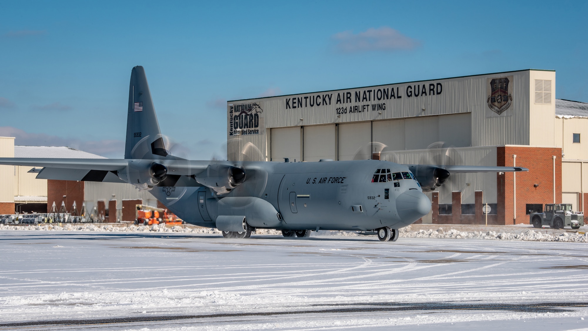 A new U.S. Air Force C-130J Super Hercules aircraft arrives at the Kentucky Air National Guard Base in Louisville, Kentucky, Jan. 7, 2022, with the director of the Air National Guard, U.S. Air Force Lt. Gen. Michael A. Loh, on board. The aircraft, being delivered to the 123rd Airlift Wing from the Lockheed-Martin factory in Marietta, Georgia, is the third of eight slated for the unit, which is converting from legacy C-130H transports. (U.S. Air National Guard photo by Dale Greer)
