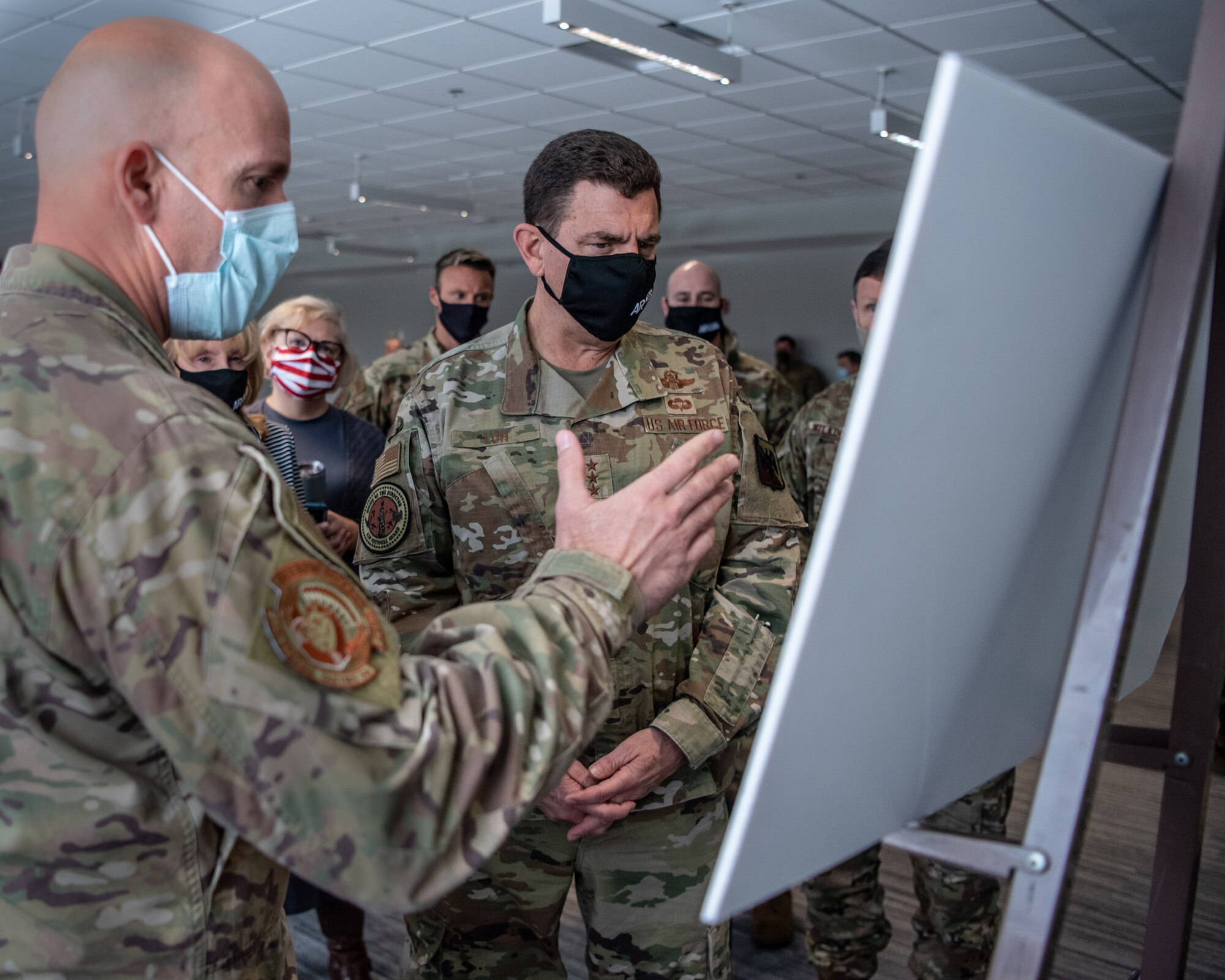 U.S. Air Force Lt. Gen. A. Michael Loh, center, director of the Air National Guard, is briefed on the recent tornado-response operations of the 123rd Special Tactics Squadron during a tour at the Kentucky Air National Guard Base in Louisville, Kentucky, Jan. 8, 2022. Loh also held a “town hall” style meeting during which he fielded questions from Kentucky Airmen. (U.S. Air National Guard photo by Tech. Sgt. Joshua Horton)