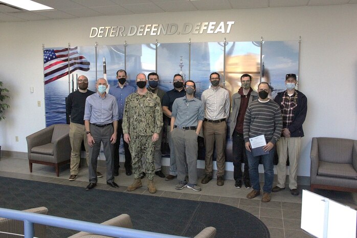 A group of NSWC Crane employees stand in a group.