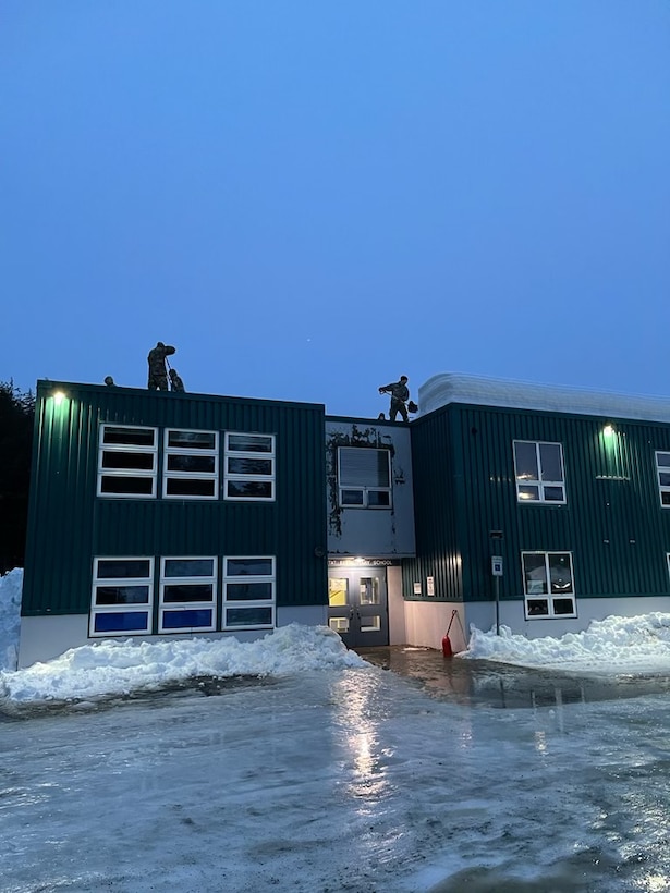 Alaska National Guard Soldiers and Airmen provide emergency assistance in the Southeast Alaska community of Yakutat, Jan. 13, 2022, after the region received tremendous amounts of snow and rain over a seven-day period. Guard members serving on Joint Task Force-Yakutat will provide building safety assessments and emergency snow removal for Tribal, public and government facilities in the community following hazardous winter weather and heavy snowfall resulting in building damage and continued risk of unsafe conditions. Yakutat is in the Tongass National Forest, the largest National Forest in the U.S. and home to the largest population of bald eagles in the world. The Alaska National Guard is trained, equipped and ready to provide disaster response support for the State of Alaska when requested by civil authorities. (U.S. Army National Guard photo by Dana Rosso)