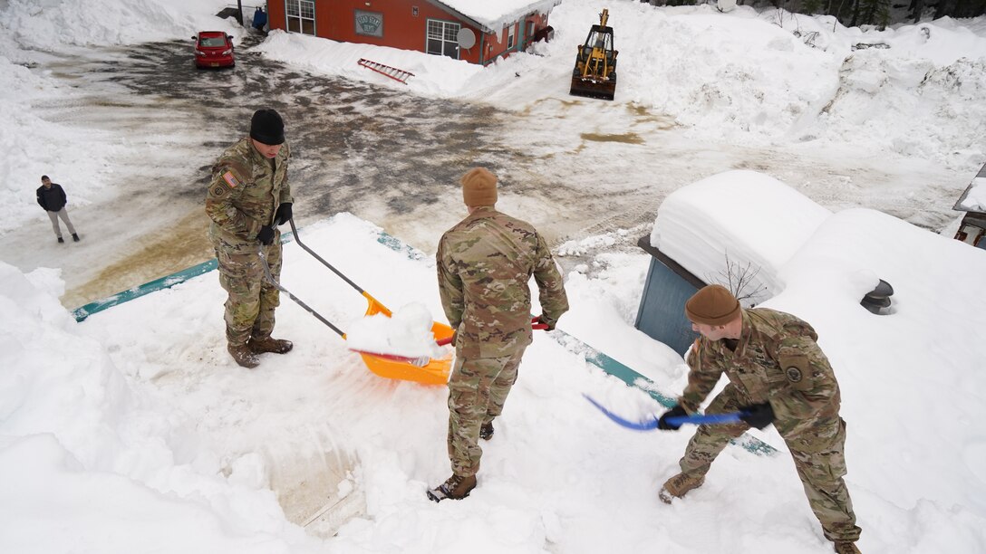 Alaska National Guard Soldiers and Airmen provide emergency assistance in the Southeast Alaska community of Yakutat, Jan. 12, 2022, after the region received tremendous amounts of snow and rain over a seven-day period. Guard members serving on Joint Task Force-Yakutat will provide building safety assessments and emergency snow removal for Tribal, public and government facilities in the community following hazardous winter weather and heavy snowfall resulting in building damage and continued risk of unsafe conditions. Yakutat is in the Tongass National Forest, the largest National Forest in the U.S. and home to the largest population of bald eagles in the world. The Alaska National Guard is trained, equipped and ready to provide disaster response support for the State of Alaska when requested by civil authorities. (U.S. Army National Guard photo by Dana Rosso)