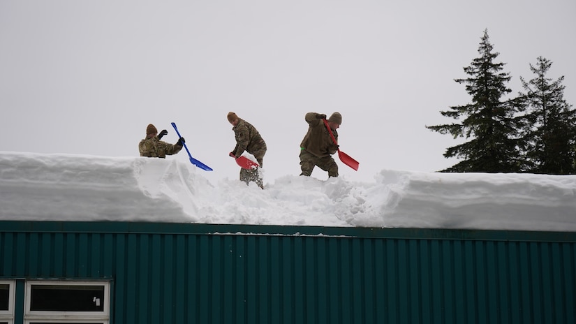 Alaska National Guard Soldiers and Airmen provide emergency assistance in the Southeast Alaska community of Yakutat, Jan. 12, 2022, after the region received tremendous amounts of snow and rain over a seven-day period. Guard members serving on Joint Task Force-Yakutat will provide building safety assessments and emergency snow removal for Tribal, public and government facilities in the community following hazardous winter weather and heavy snowfall resulting in building damage and continued risk of unsafe conditions. Yakutat is in the Tongass National Forest, the largest National Forest in the U.S. and home to the largest population of bald eagles in the world. The Alaska National Guard is trained, equipped and ready to provide disaster response support for the State of Alaska when requested by civil authorities. (U.S. Army National Guard photo by Dana Rosso)