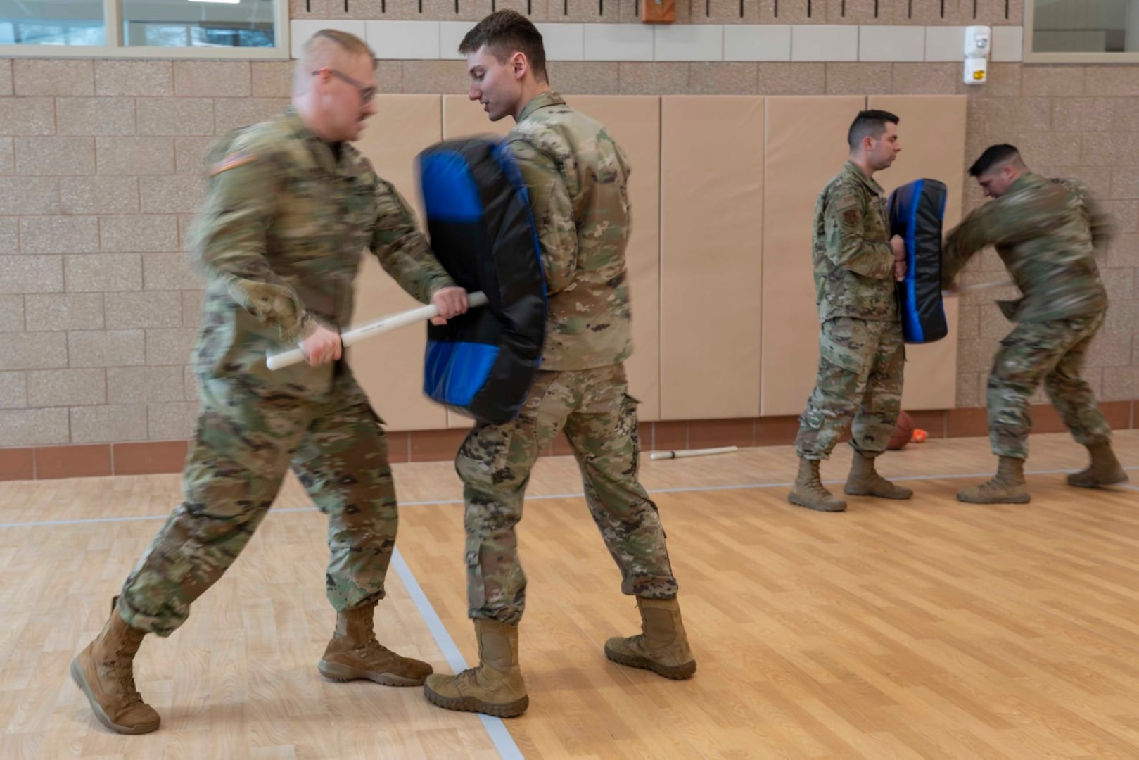 From left, Spc. Jeremy Wilkens and Spc. Greg Marquis of the 237th Military Police Company, New Hampshire Army National Guard, practice baton tactics Jan. 7, 2022, at the Edward Cross Training Center in Pembroke, New Hampshire.