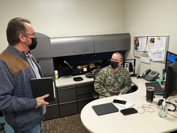 U.S. Navy Lt. Cmdr. Hunter Coates, assigned to Naval Medical Forces Pacific, works in office as regional information systems officer. The Director of Navy Medical Service Corps selected Coates as senior information technology officer of the year Dec. 16, 2021. (U.S. Navy photo by David A. Bennett)