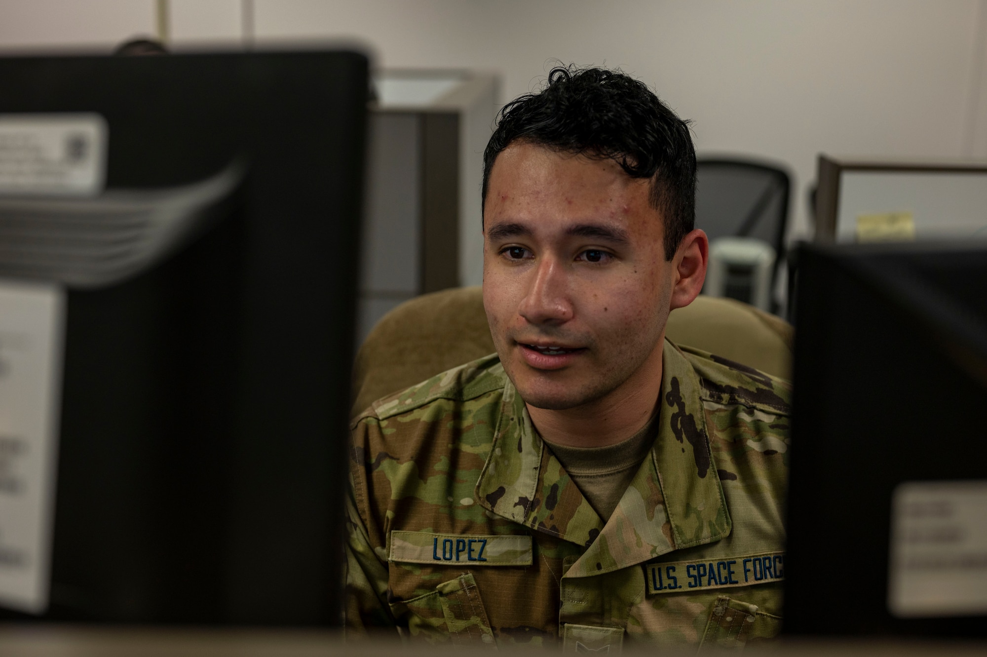 a man looking at a computer screen