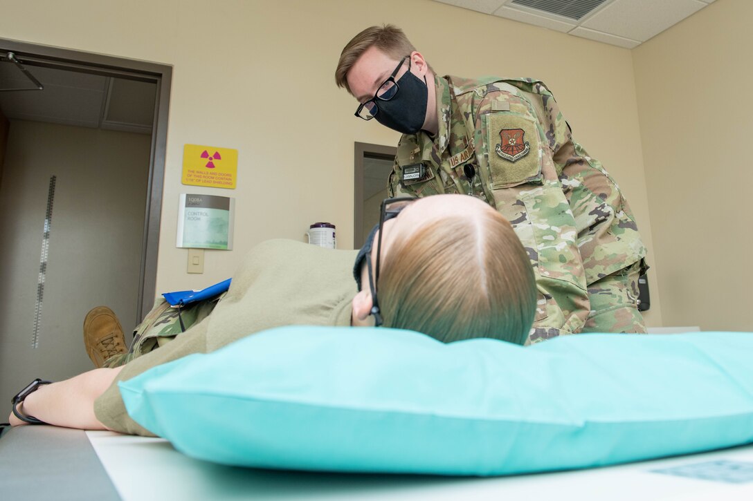 U.S. Air Force Senior Airman Emily Campos, 28th Operational Medical Readiness Squadron diagnostic imaging technologist, and U.S. Air Force Staff Sgt. Timothy McKenna, 28th Operational Medical Readiness Squadron diagnostic imaging technologist, conduct training at Ellsworth Air Force Base, S.D., Jan. 10, 2021.