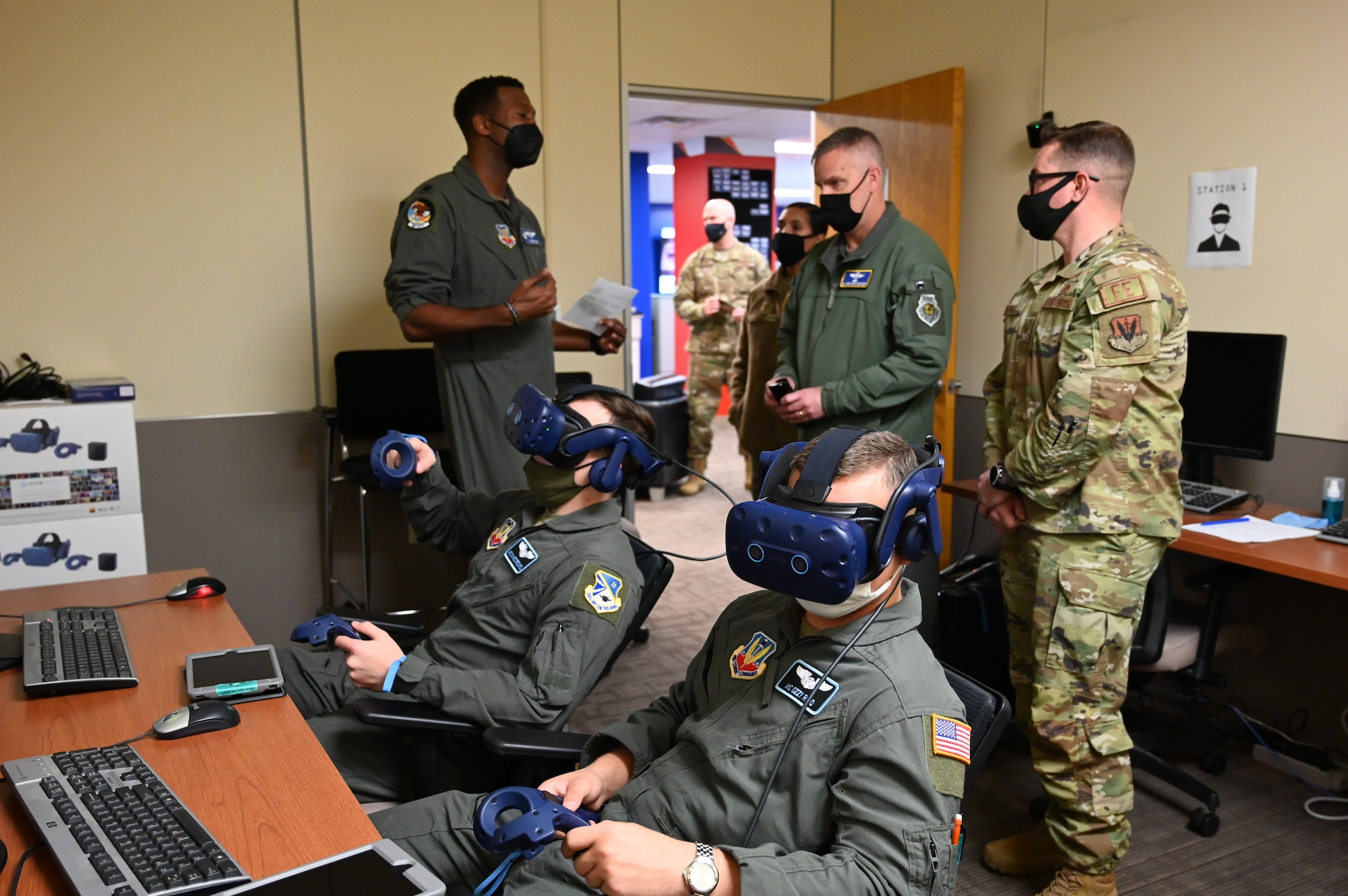 Two individuals demonstrating virtual reality system