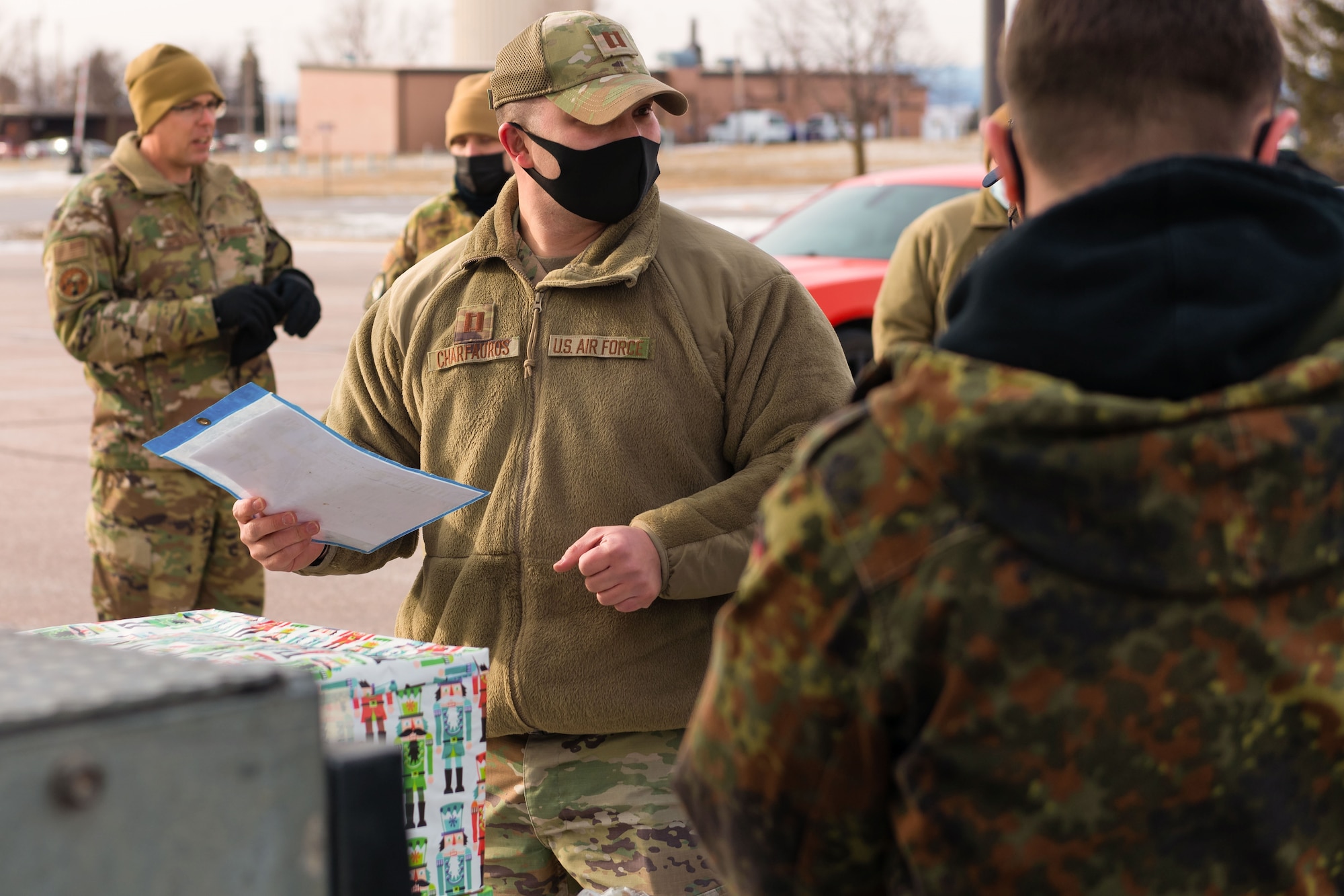 U.S. Air Force Capt. Travis Charfauros, 28th Aircraft Maintenance Squadron the director of operations with the 28th AMXS maintenance squadron, assists in a meat donation, on at Ellsworth Air Force Base, S.D., Jan. 6, 2022.