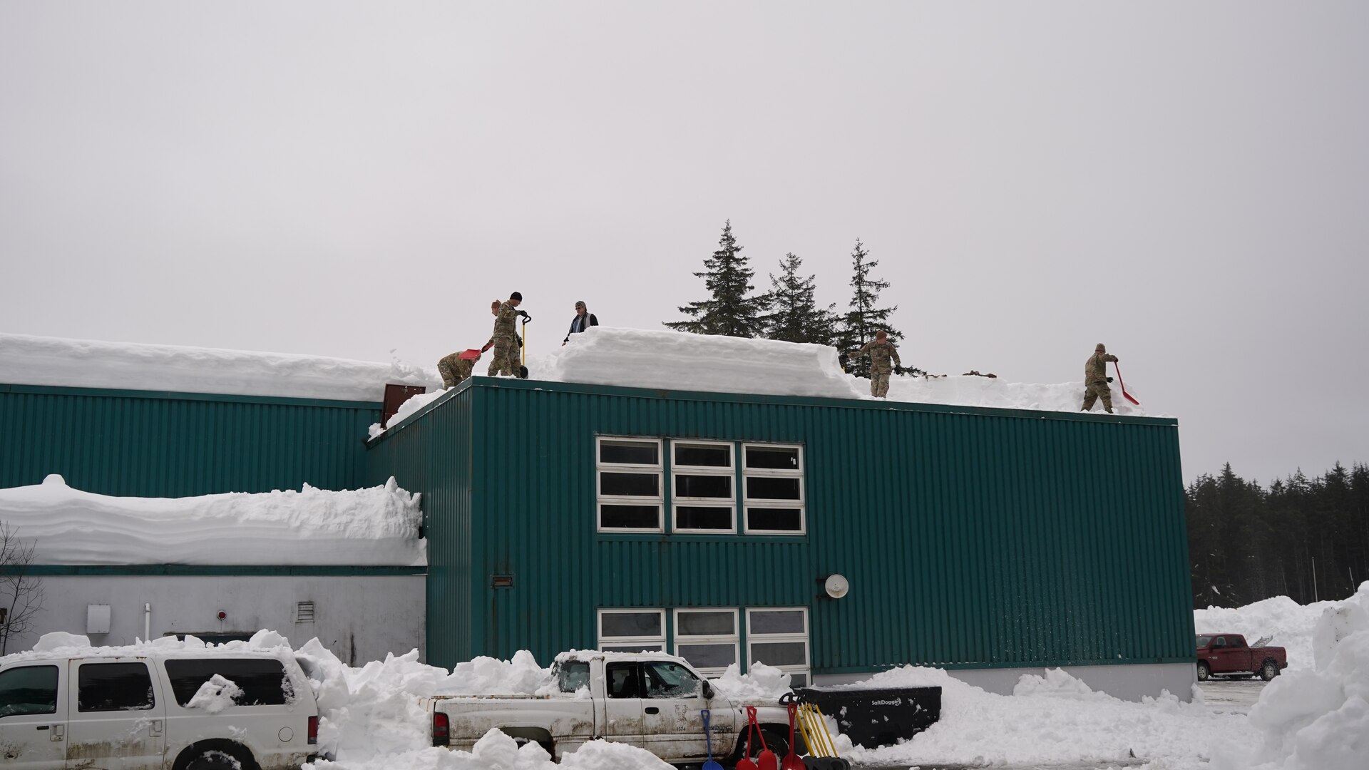 Alaska National Guard Soldiers and Airmen provide emergency assistance in the Southeast Alaska community of Yakutat, Jan. 12, 2022, after the region received tremendous amounts of snow and rain over a seven-day period. Guard members serving on Joint Task Force-Yakutat will provide building safety assessments and emergency snow removal for Tribal, public and government facilities in the community following hazardous winter weather and heavy snowfall resulting in building damage and continued risk of unsafe conditions. Yakutat is in the Tongass National Forest, the largest National Forest in the U.S. and home to the largest population of bald eagles in the world. The Alaska National Guard is trained, equipped and ready to provide disaster response support for the State of Alaska when requested by civil authorities. (U.S. Army National Guard photo by Dana Rosso)