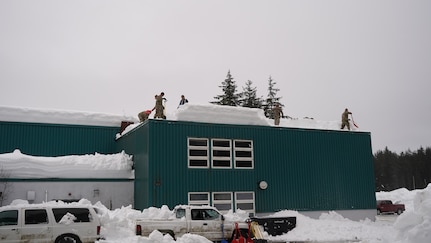 Alaska National Guard Soldiers and Airmen provide emergency assistance in the Southeast Alaska community of Yakutat, Jan. 12, 2022, after the region received tremendous amounts of snow and rain over a seven-day period. Guard members serving on Joint Task Force-Yakutat will provide building safety assessments and emergency snow removal for Tribal, public and government facilities in the community following hazardous winter weather and heavy snowfall resulting in building damage and continued risk of unsafe conditions. Yakutat is in the Tongass National Forest, the largest National Forest in the U.S. and home to the largest population of bald eagles in the world. The Alaska National Guard is trained, equipped and ready to provide disaster response support for the State of Alaska when requested by civil authorities. (U.S. Army National Guard photo by Dana Rosso)