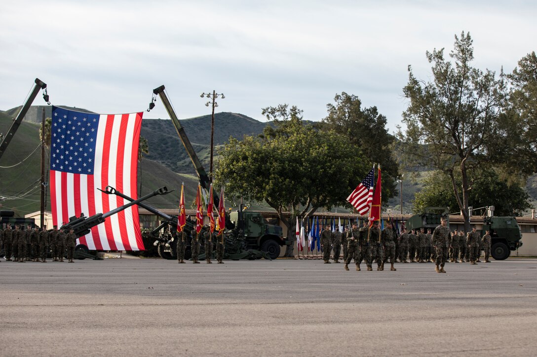 U.S. Marines with 11th Marine Regiment, 1st Marine Division, stand in formation prior to a battle colors ceremony at Marine Corps Base Camp Pendleton, California, Jan. 12, 2022. Veterans and active duty Marines and Sailors attended the annual ceremony to pay tribute to the Marines that have served with the regiment. (U.S. Marine Corps photo by Sgt. Hannah Hall)
