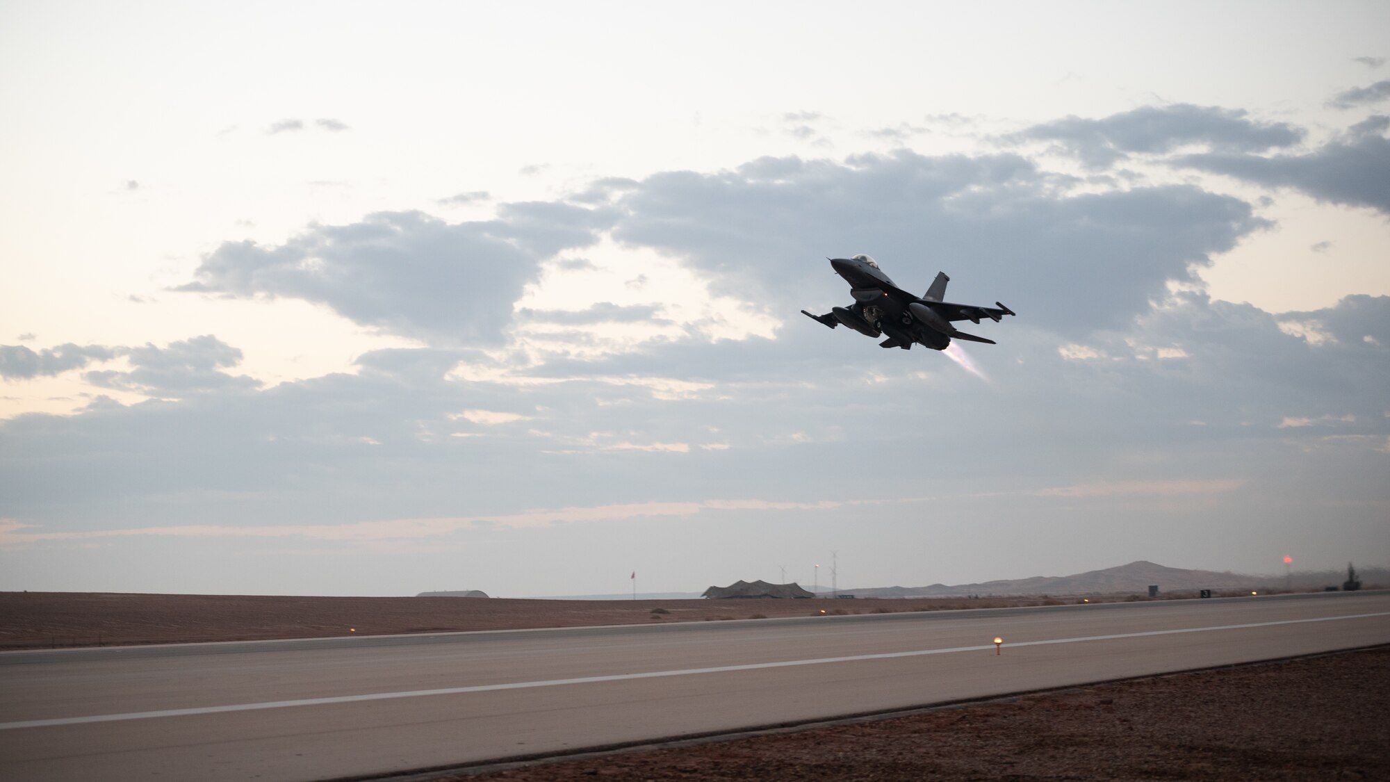 A U.S. Air Force F-16 Fighting Falcon takes off from Prince Sultan Air Base, Kingdom of Saudi Arabia, Jan. 4, 2022, to participate in joint interoperability training with a variety of aircraft, to include U.S. Air Force E-11A Battlefield Airborne Communications Node (BACN) and U.S. Marine F/A-18 Hornets. Complex missions such as these increase aircrew’s abilities across U.S. Central Command’s area of responsibility, ultimately strengthening the lethality of the total force. (U.S. Air Force photo by Senior Airman Jacob B. Wrightsman)