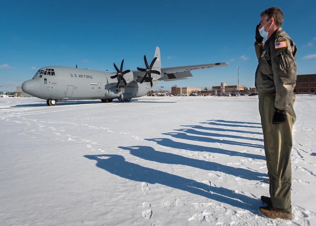 A new U.S. Air Force C-130J Super Hercules aircraft arrives at the Kentucky Air National Guard Base in Louisville, Kentucky, Jan. 7, 2022, with the director of the Air National Guard, U.S. Air Force Lt. Gen. Michael A. Loh, on board as unit leadership renders a salute. The aircraft, being delivered to the 123rd Airlift Wing from the Lockheed-Martin factory in Marietta, Georgia, is the third of eight slated for the unit, which is converting from legacy C-130H transports. (U.S. Air National Guard photo by Dale Greer)