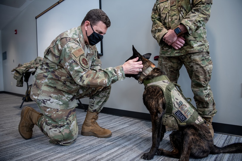 U.S. Air Force Lt. Gen. Michael A. Loh, director, Air National Guard, meets Callie, a search-and-rescue K-9 from the 123rd Special Tactics Squadron and the only search-and-rescue dog in the Department of Defense, during a visit to the Kentucky Air National Guard Base in Louisville, Kentucky, Jan. 8, 2022. Loh also held a “town hall” style meeting during which he fielded questions from Kentucky Airmen. (U.S. Air National Guard photo by Tech. Sgt. Joshua Horton)